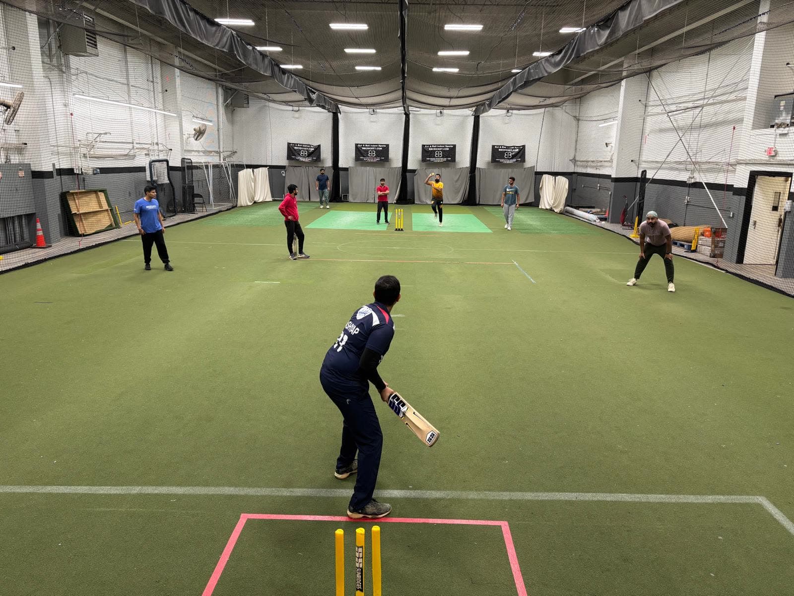A league match in play on the indoor turf at Bat x Ball